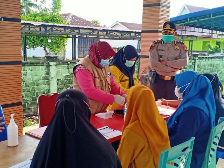 Polres Kampar Gelar Vaksinasi Hingga ke Wilayah Terpencil Desa Gunung Sari